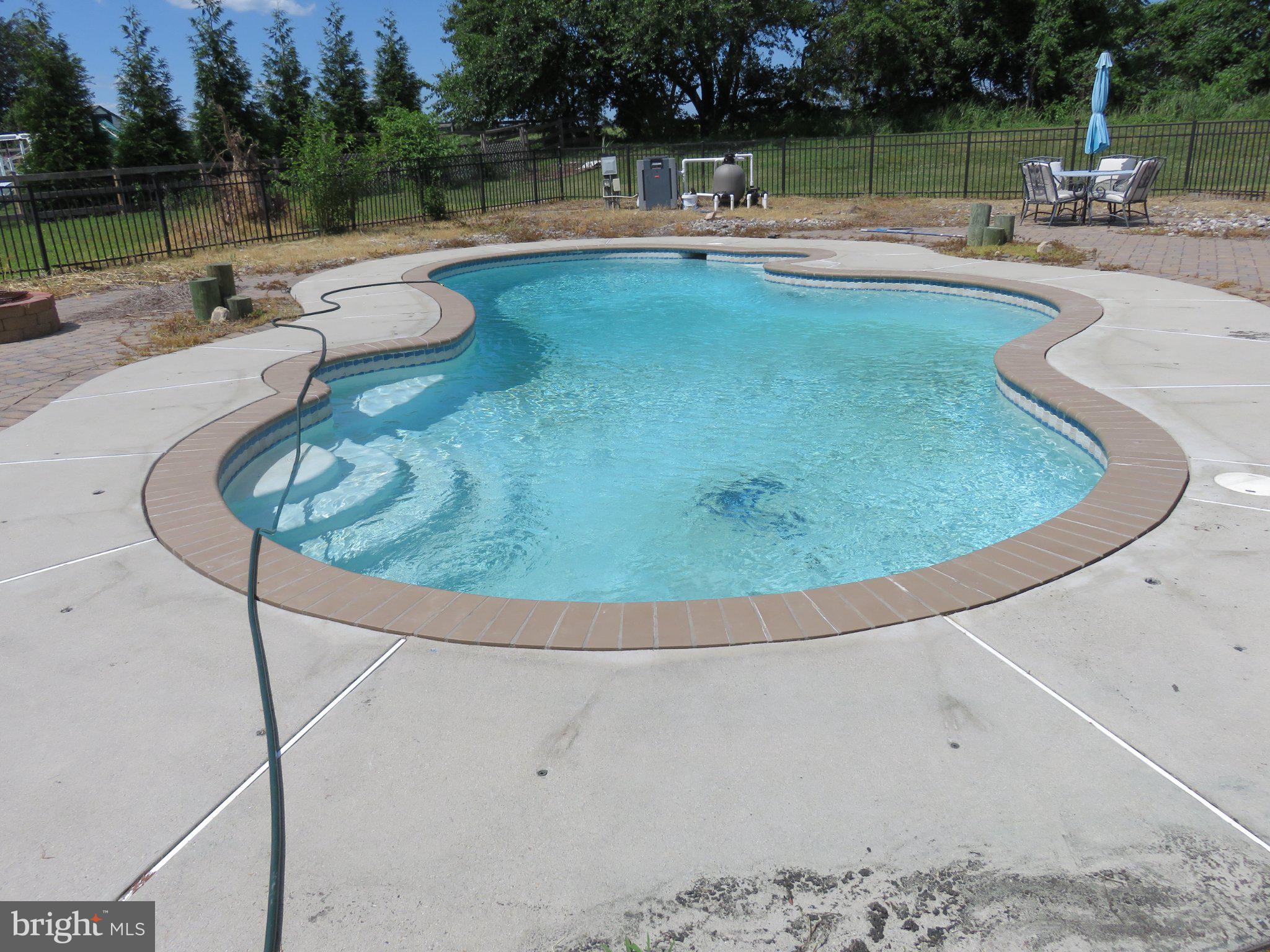 27 Bridle Ridge Circle Lewes, DE 19958 - Photo 8 of 61 Inviting pool oasis awaits summer fun.