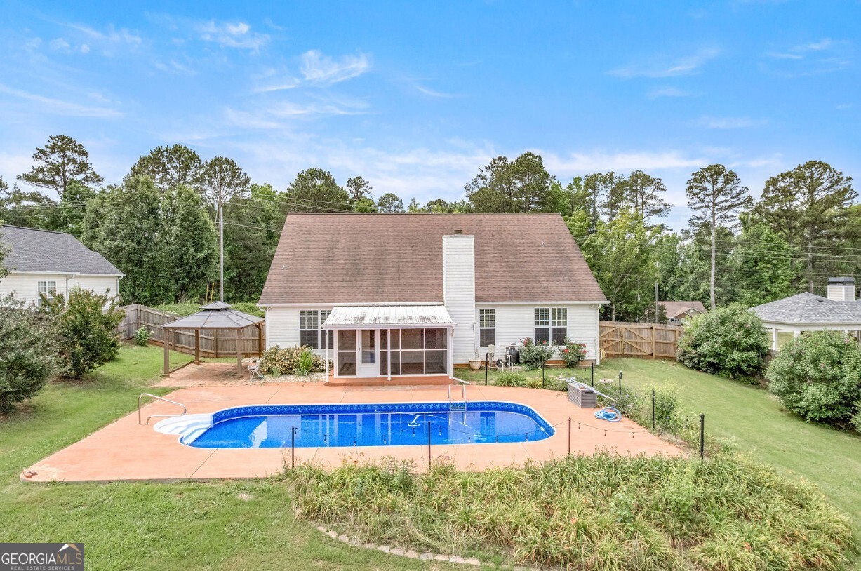 82 Newton Road LaGrange, GA 30240 - Photo 3 of 45 an aerial view of a house with swimming pool yard and outdoor seating