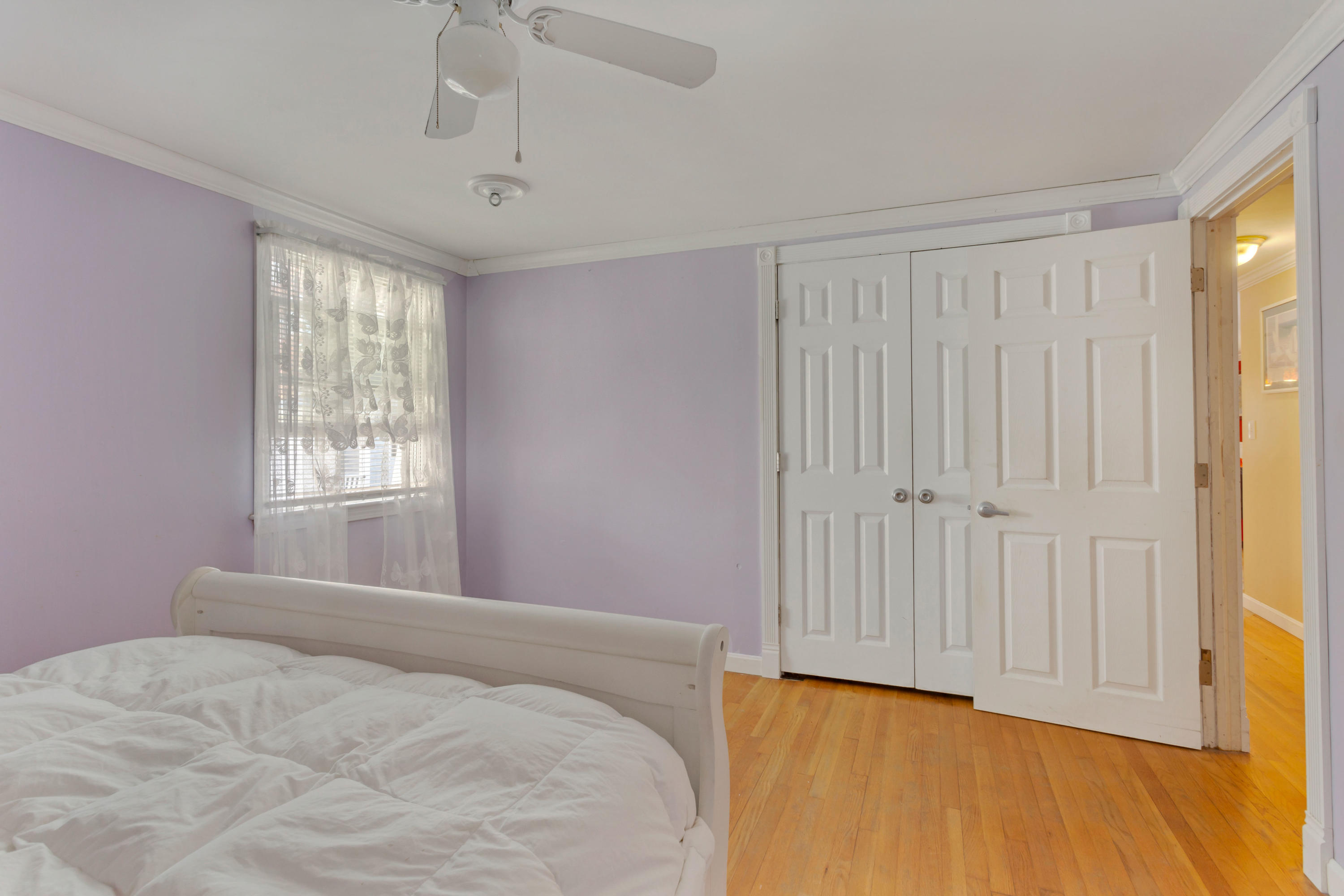 189 Highland Drive Centerville, MA 02632 - Photo 21 of 39 a bedroom with a bed and wooden floor