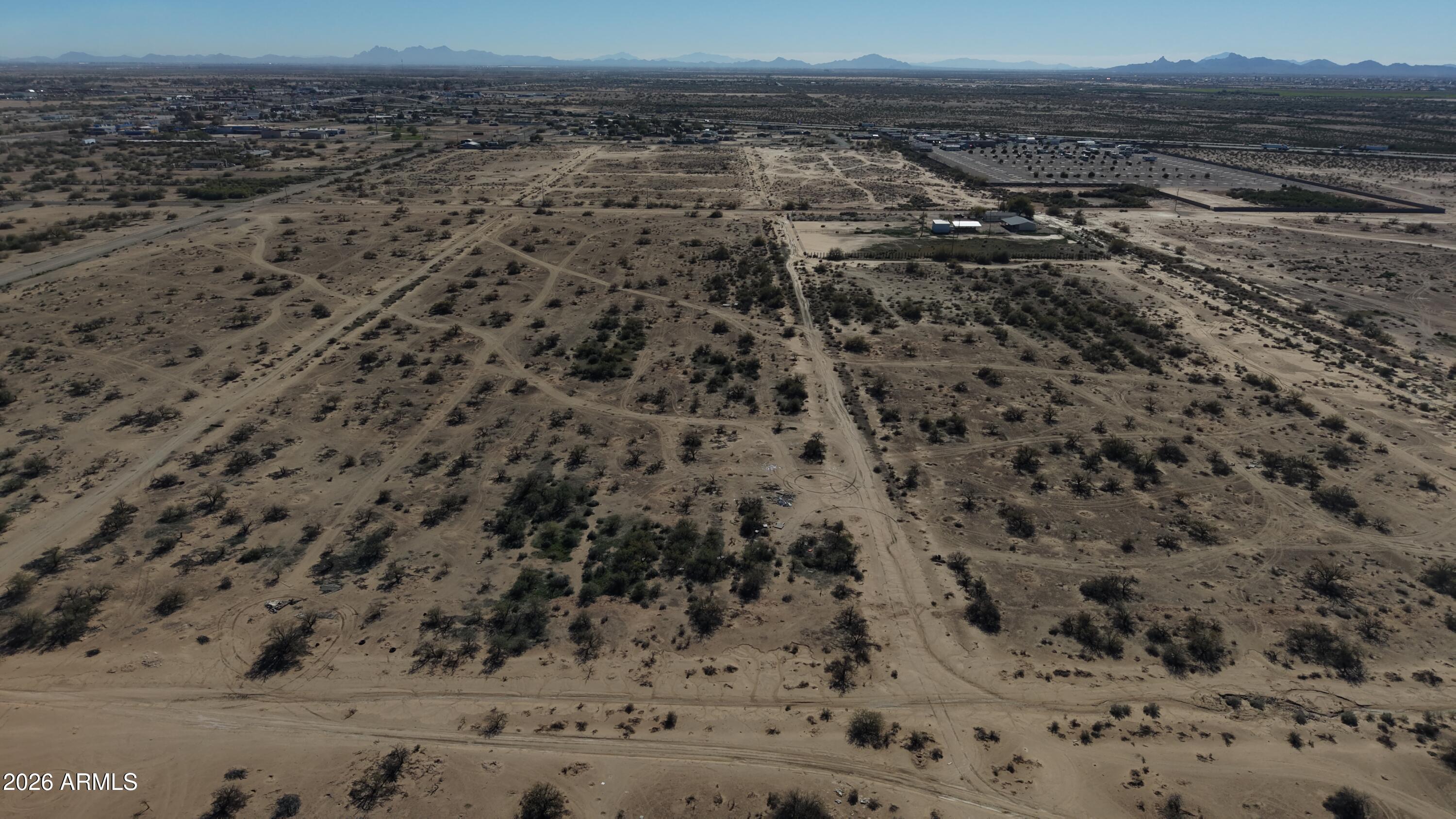 4315 West Shedd Road, Unit 1 Eloy, AZ 85131 - Photo 4 of 19 a view of a dry yard with wooden floor and city view