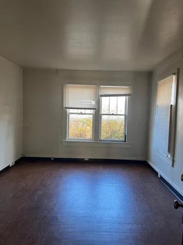 an empty room with windows