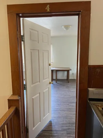 a view of a kitchen from the hallway