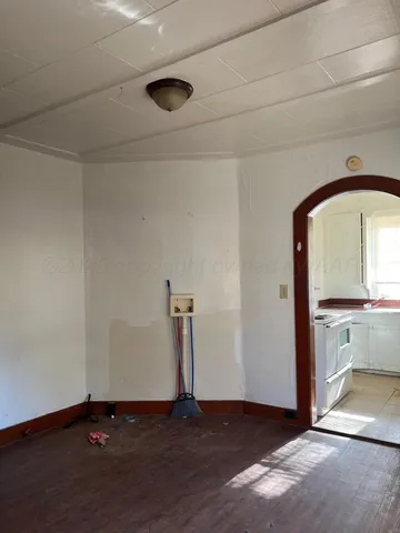 an empty room with a sink