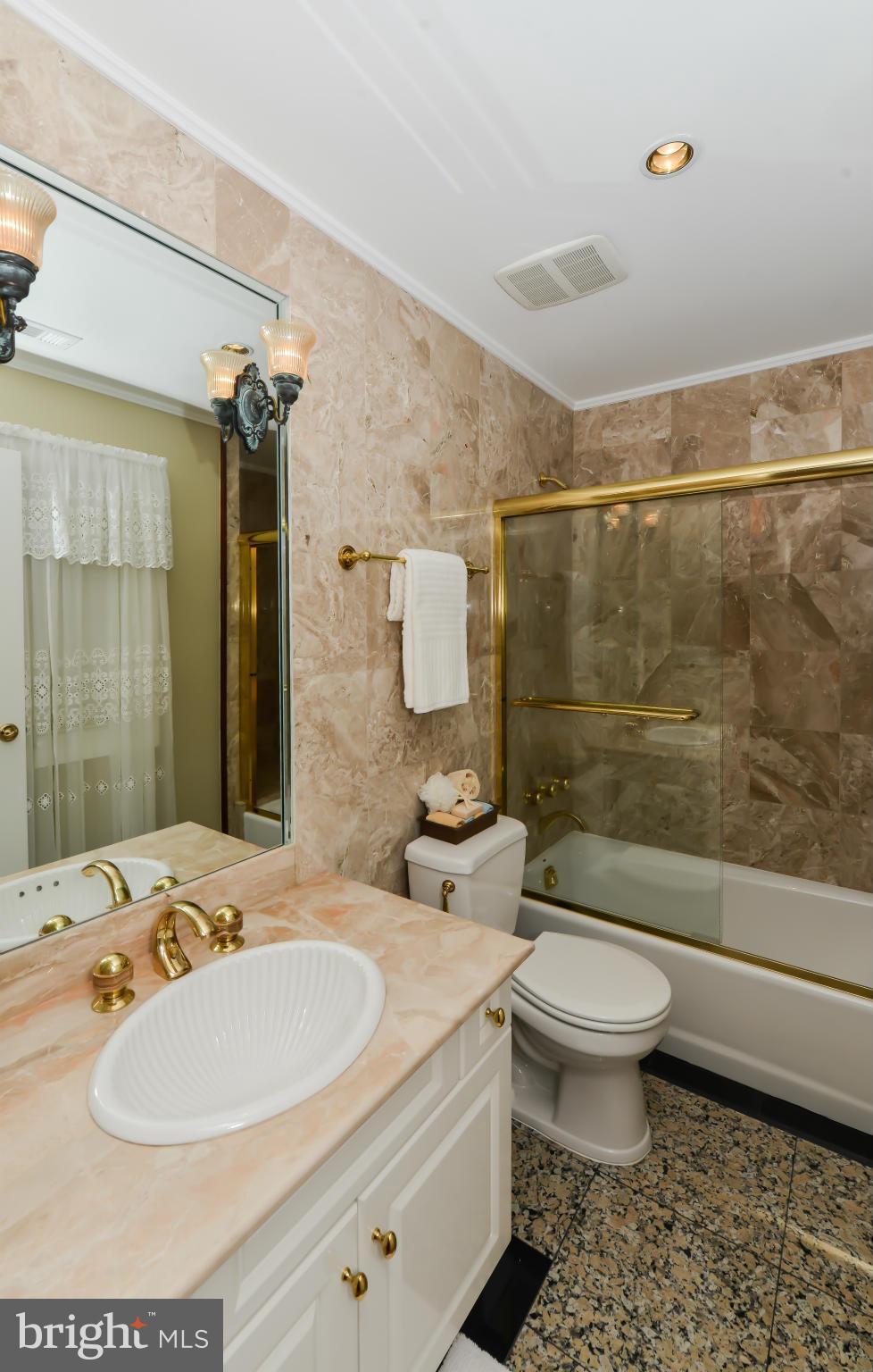 7717 Southdown Road Alexandria, VA 22308 - Photo 14 of 30 Powder Room with granite floor