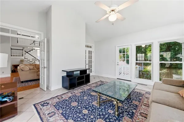 a living room with furniture and a rug