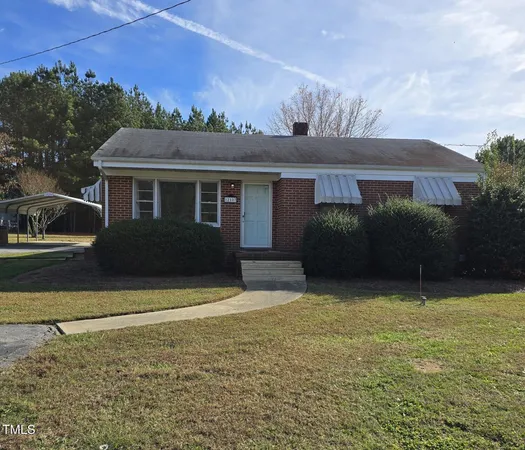 front view of a house with a yard