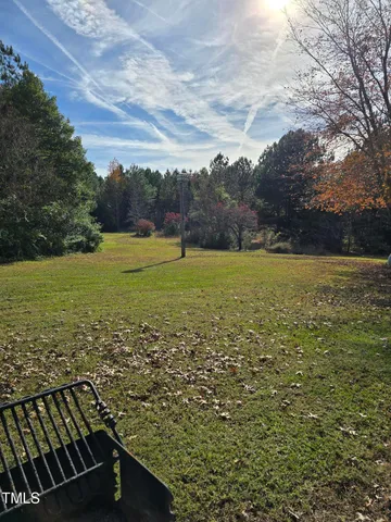 a view of a field with an ocean