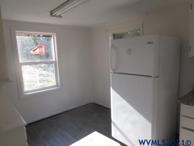 6912 Liberty Road South Salem, OR 97306 - Photo 4 of 37 a view of an empty room with wooden floor and a window