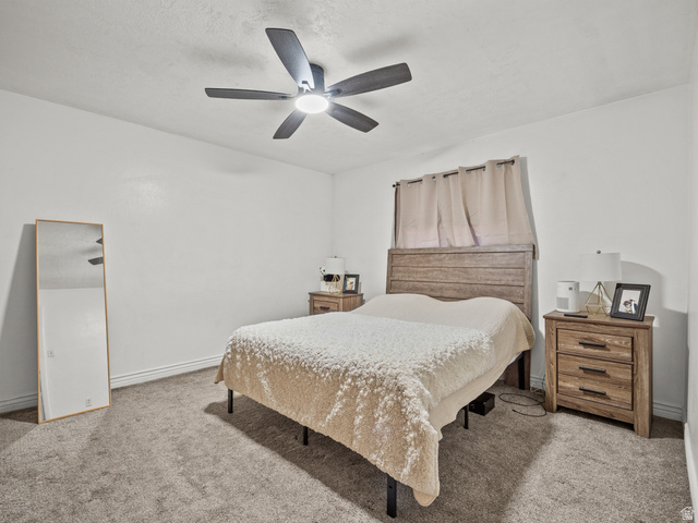 460 200 South Provo, UT 84606 - Photo 49 of 66 Bedroom with light colored carpet and a ceiling fan