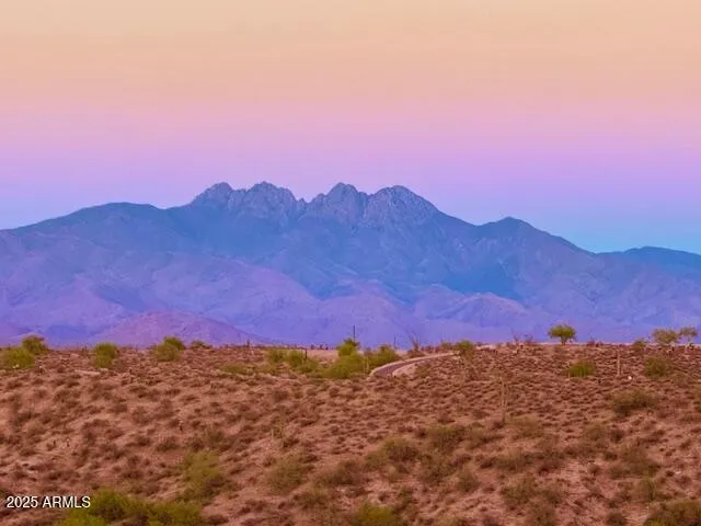 a view of sunset and a mountain