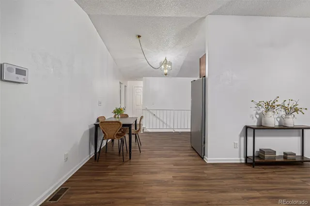 a kitchen with stainless steel appliances granite countertop a stove and a refrigerator