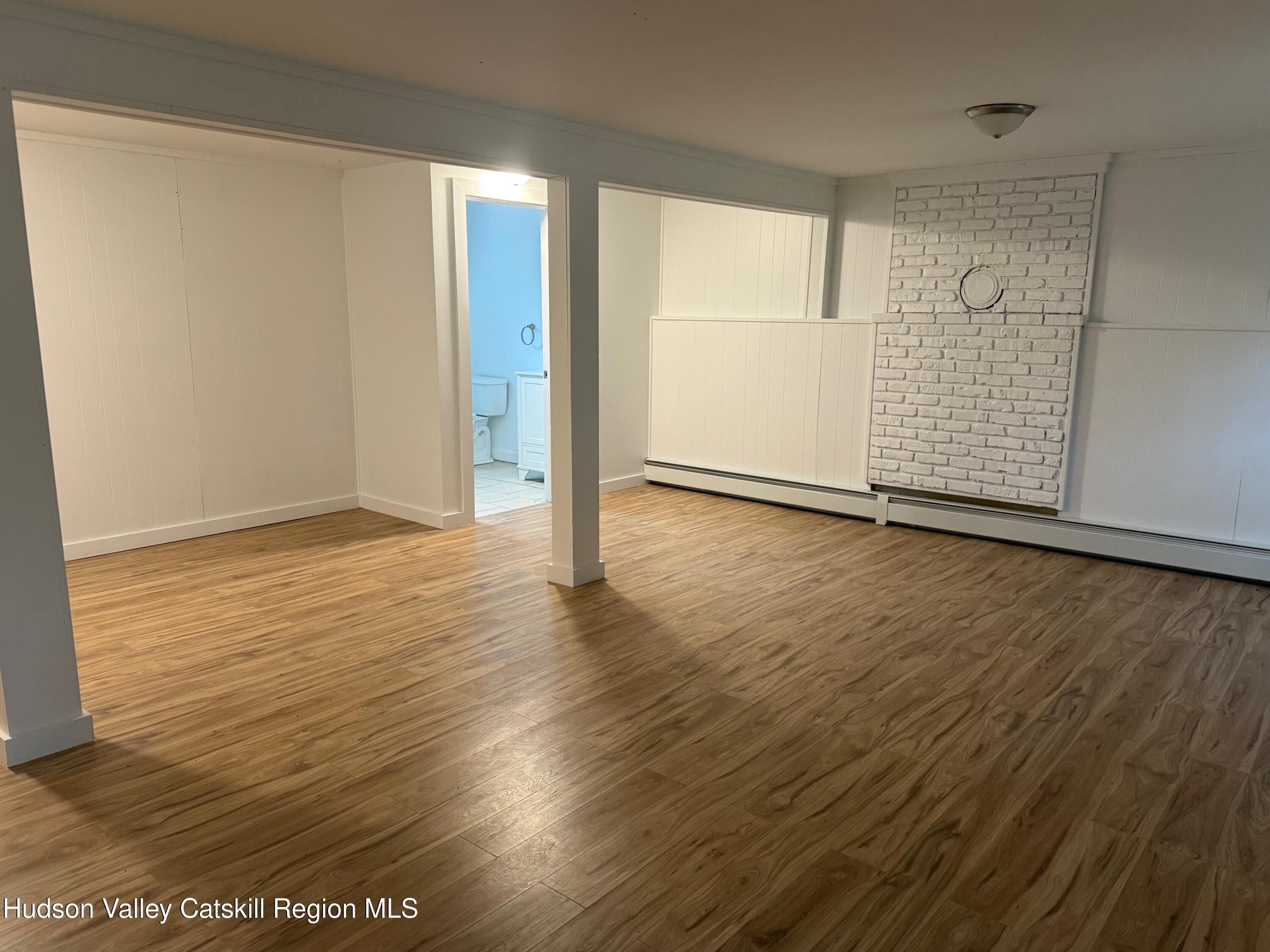 6 Van Orden Road Milton, NY 12547 - Photo 13 of 21 a view of an empty room with wooden floor and a window