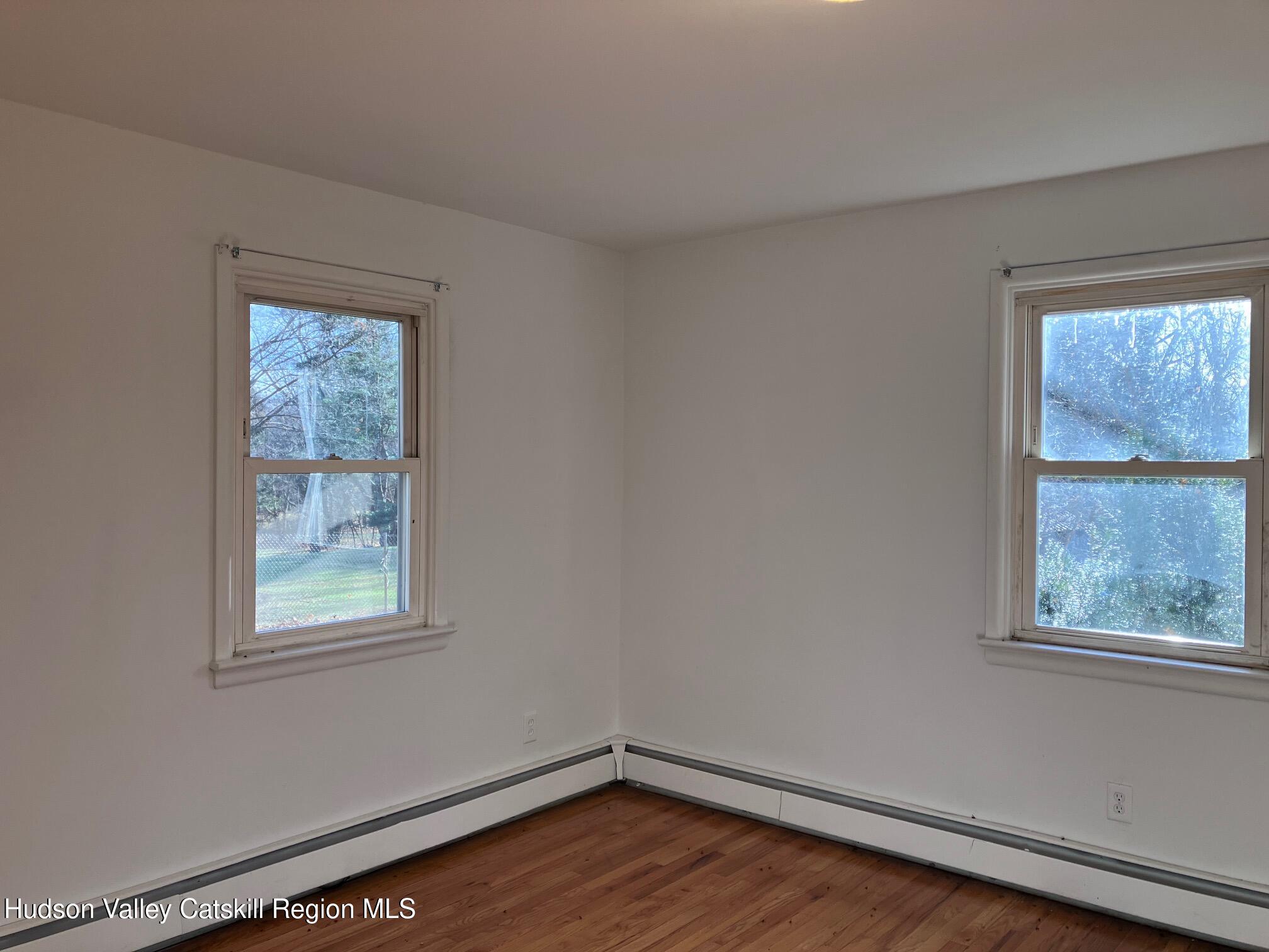 6 Van Orden Road Milton, NY 12547 - Photo 16 of 21 a view of an empty room with wooden floor and a window
