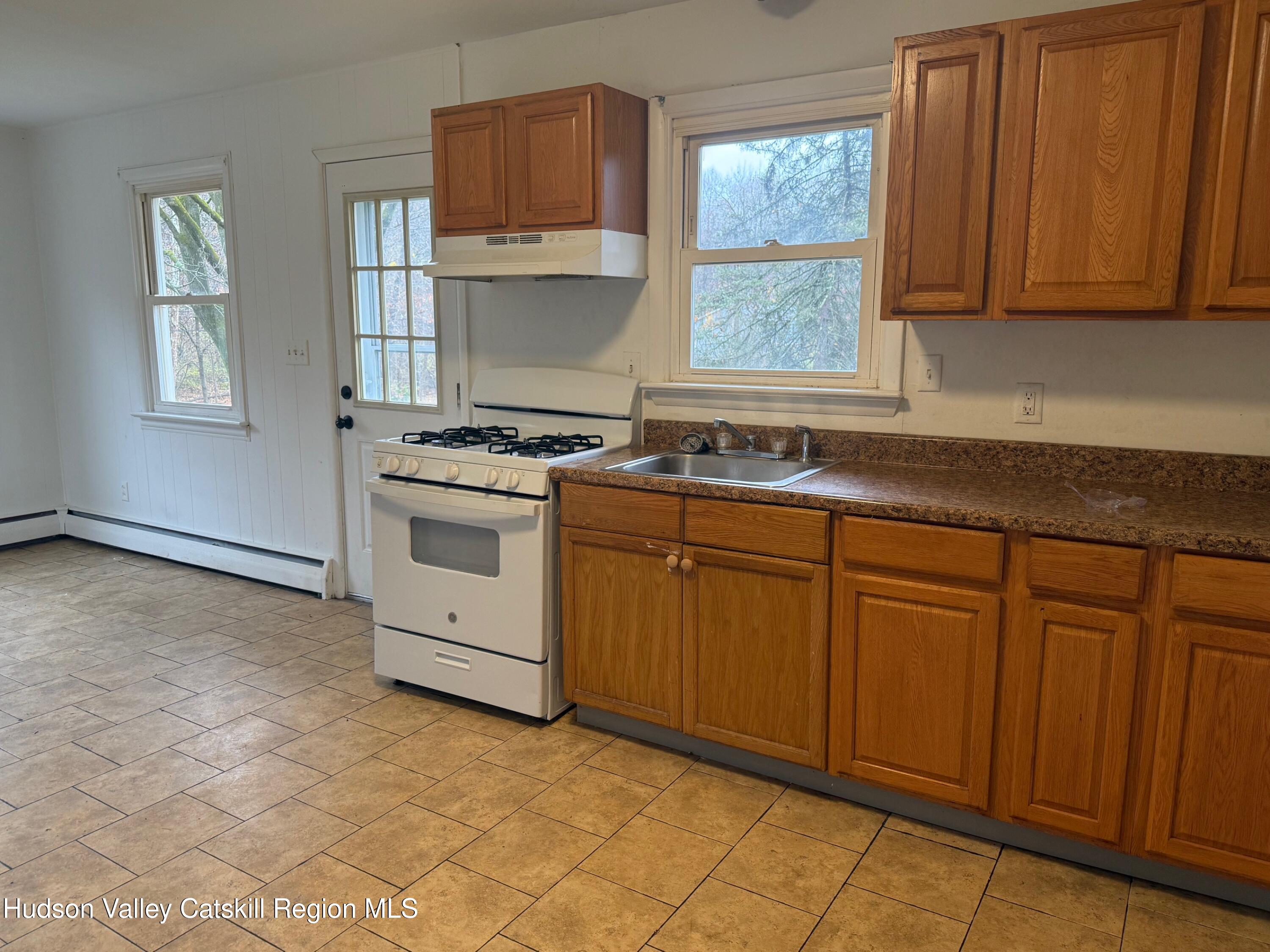 6 Van Orden Road Milton, NY 12547 - Photo 6 of 21 a kitchen with granite countertop a sink stainless steel appliances and cabinets