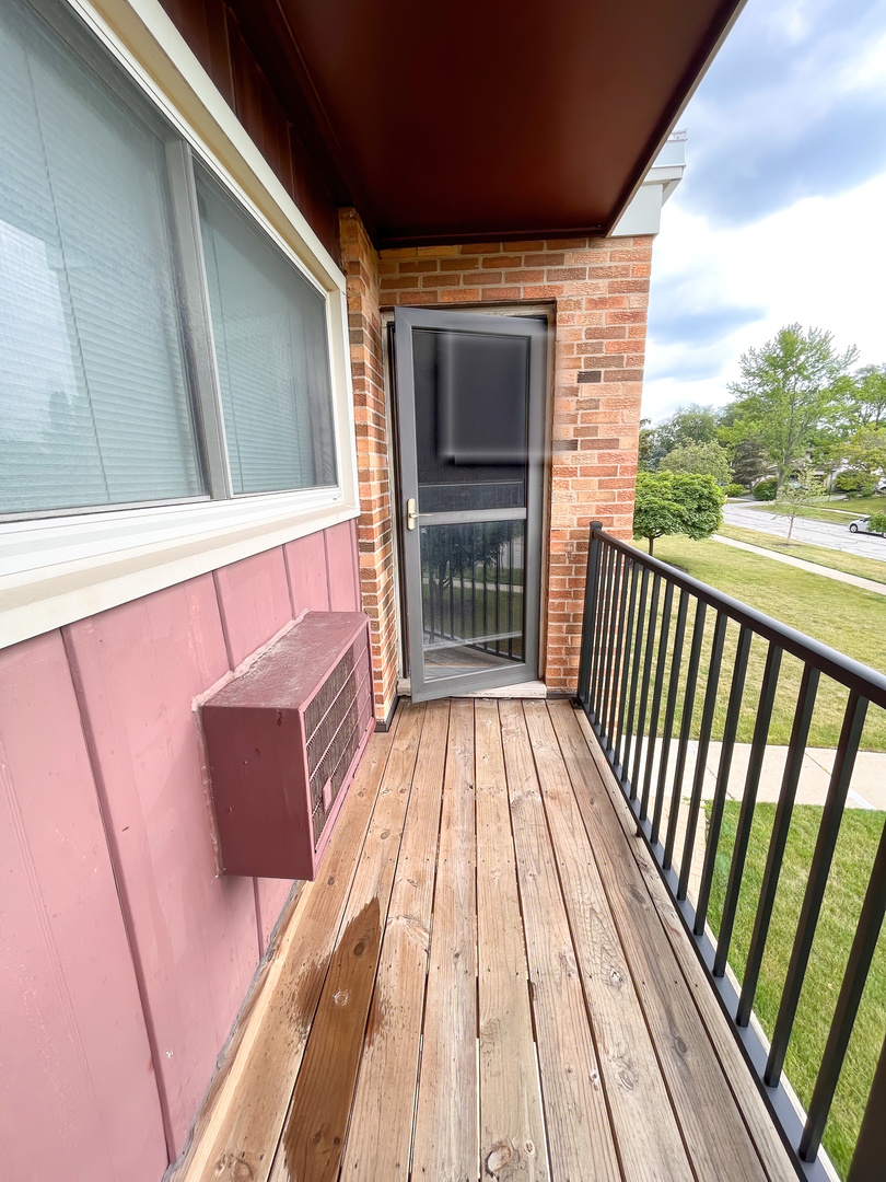 1313 A South Rebecca Road, Unit 218 Lombard, IL 60148 - Photo 15 of 19 a view of balcony with a flat screen tv
