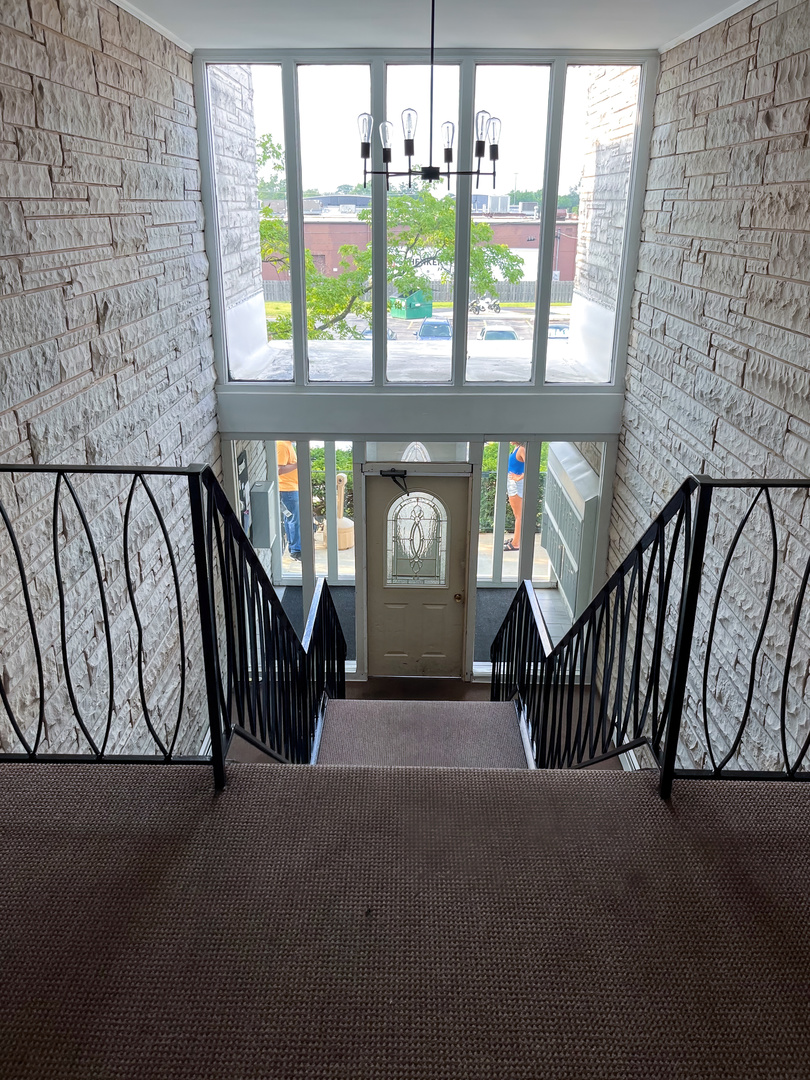 1313 A South Rebecca Road, Unit 218 Lombard, IL 60148 - Photo 4 of 19 a view of hallway with windows