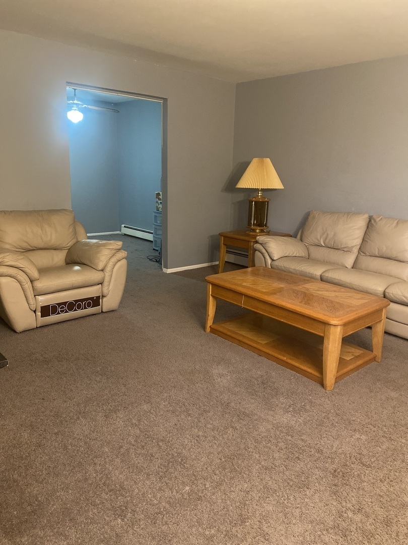 1313 A South Rebecca Road, Unit 218 Lombard, IL 60148 - Photo 10 of 19 a backyard of a house with table and chairs
