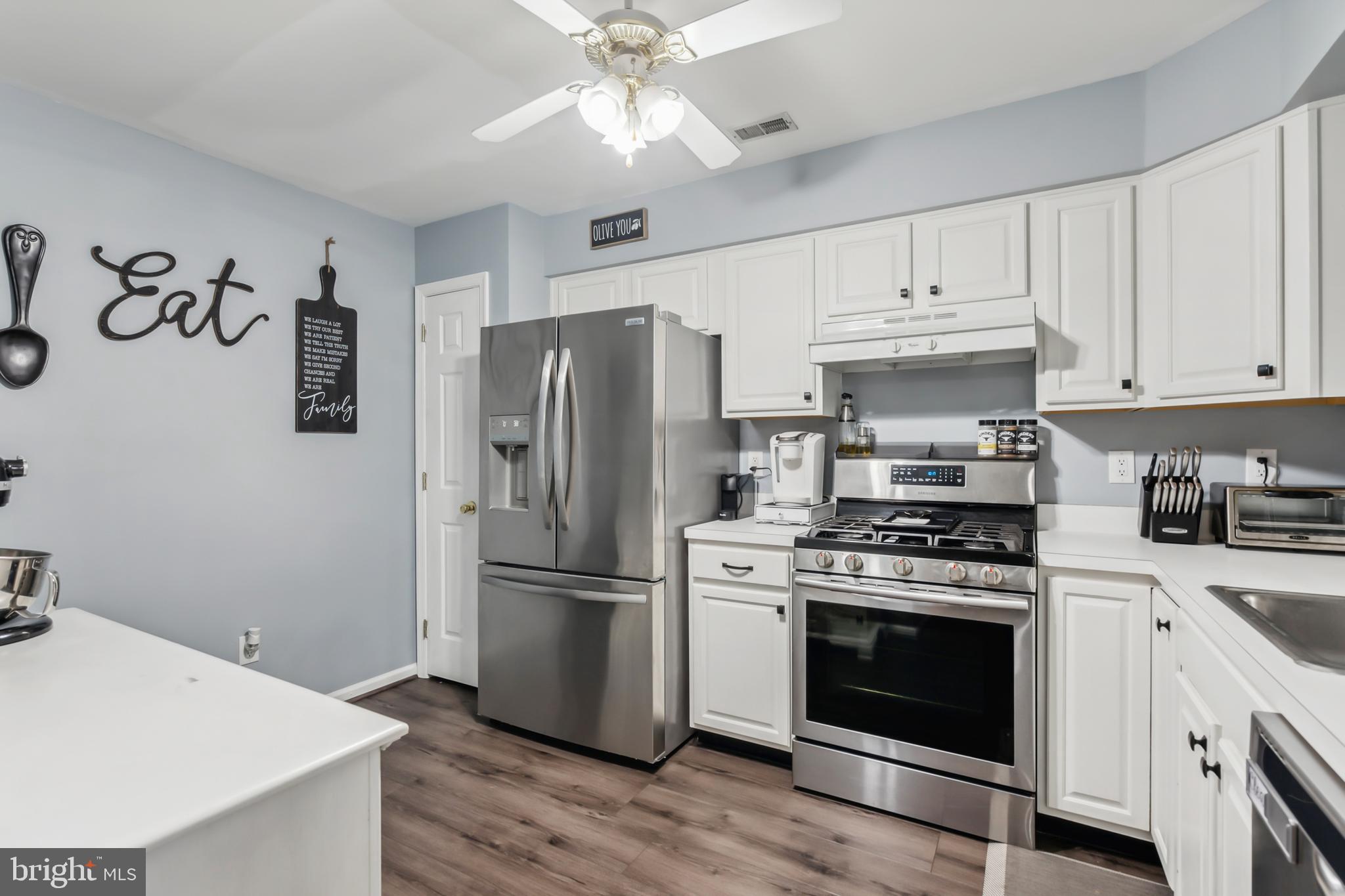 1102 Coventry Way Mount Laurel, NJ 08054 - Photo 11 of 24 a kitchen with a stove a refrigerator and a sink