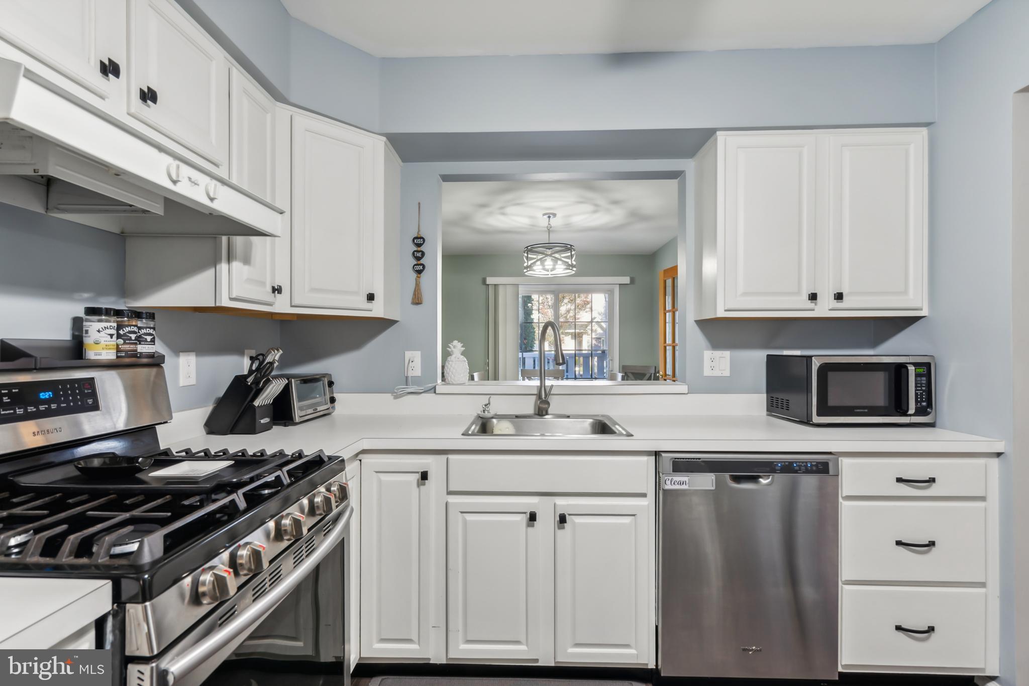 1102 Coventry Way Mount Laurel, NJ 08054 - Photo 13 of 24 a kitchen with white cabinets and appliances
