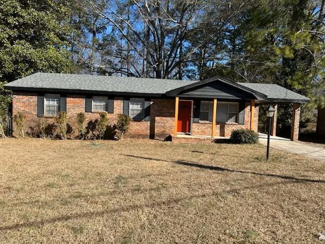 5380 St Lo Lane Atlanta, GA 30349 - Photo 1 of 1 a front view of a house with garden