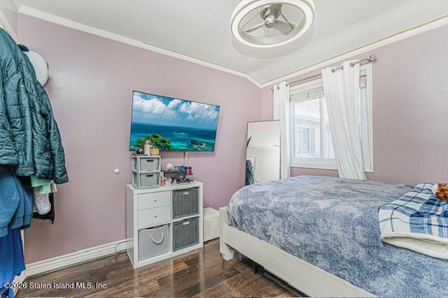 442 Ilyssa Way Staten Island, NY 10312 - Photo 19 of 25 a bedroom with a bed and a chandelier