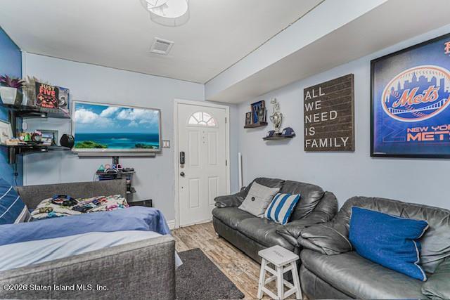 442 Ilyssa Way Staten Island, NY 10312 - Photo 21 of 25 a living room with furniture and a flat screen tv