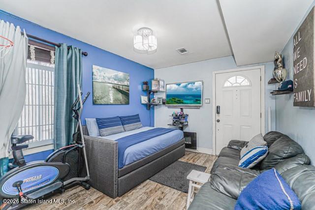 442 Ilyssa Way Staten Island, NY 10312 - Photo 24 of 25 a bedroom with a bed couch and a window