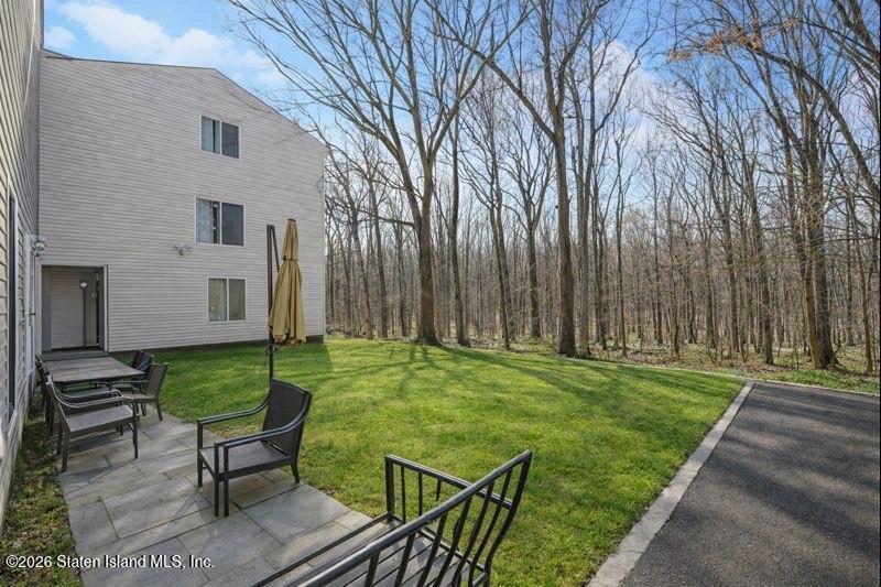 442 Ilyssa Way Staten Island, NY 10312 - Photo 25 of 25 a backyard of a house with seating space