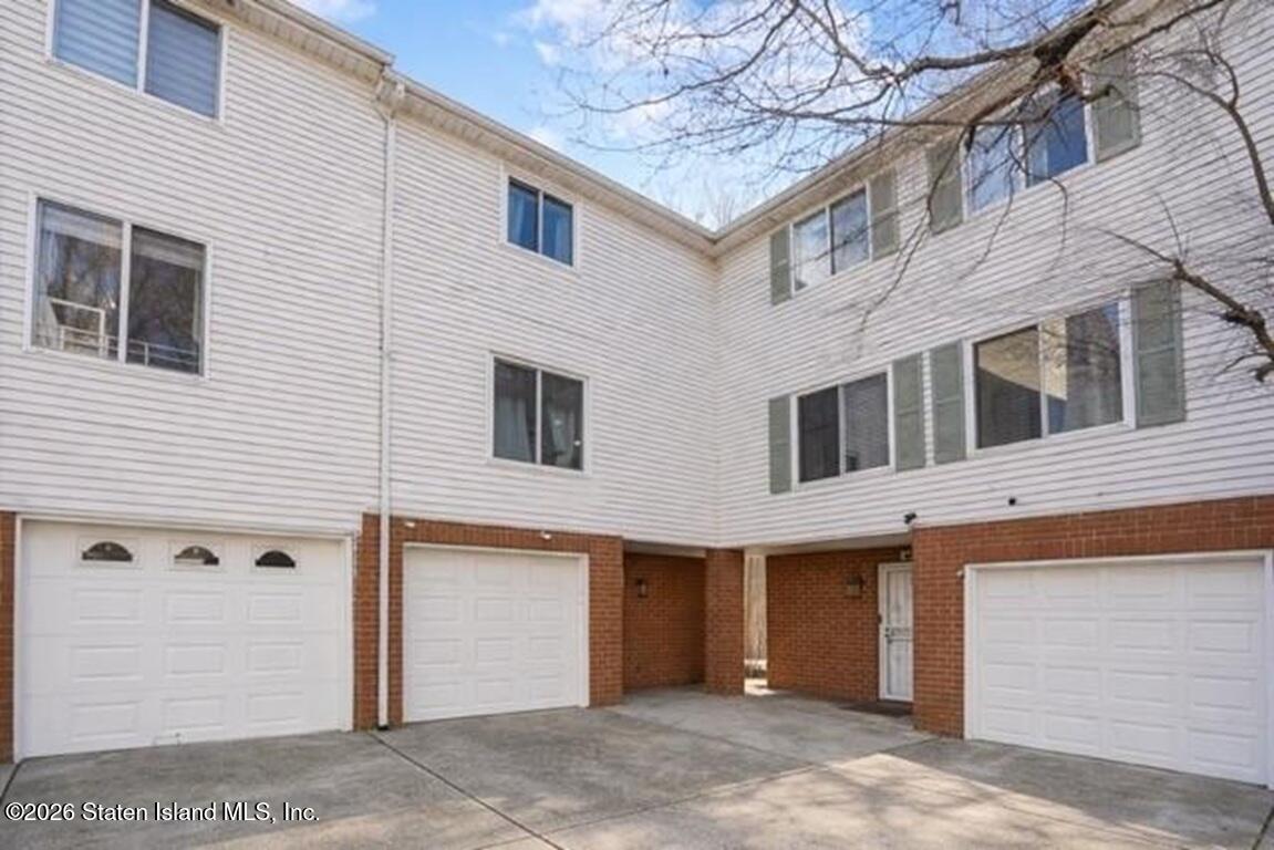 442 Ilyssa Way Staten Island, NY 10312 - Photo 26 of 26 a view of a white house with a large windows