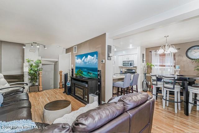 442 Ilyssa Way Staten Island, NY 10312 - Photo 5 of 25 a living room with furniture and a flat screen tv