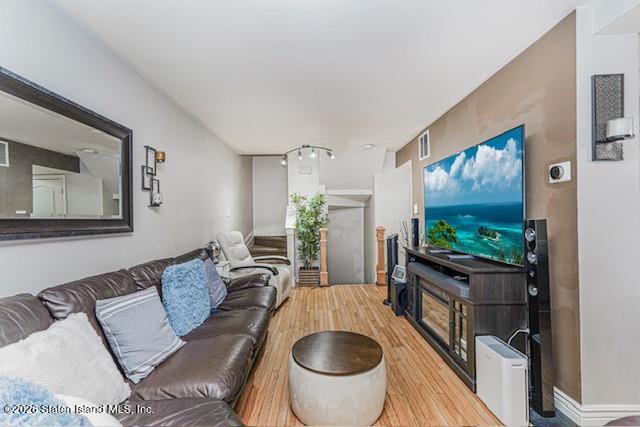 442 Ilyssa Way Staten Island, NY 10312 - Photo 6 of 25 a living room with furniture and a flat screen tv