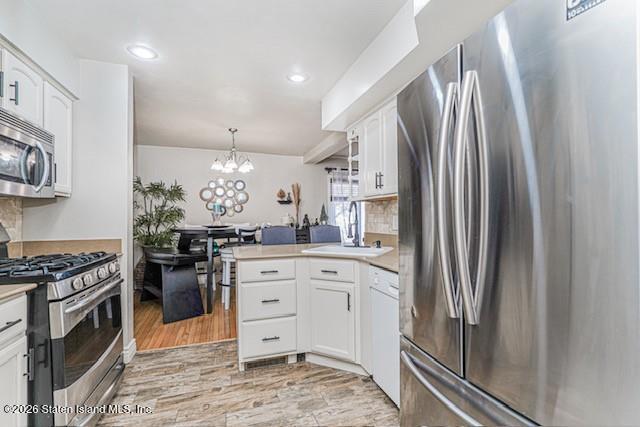 442 Ilyssa Way Staten Island, NY 10312 - Photo 10 of 25 a kitchen with stainless steel appliances granite countertop a refrigerator a stove and a sink