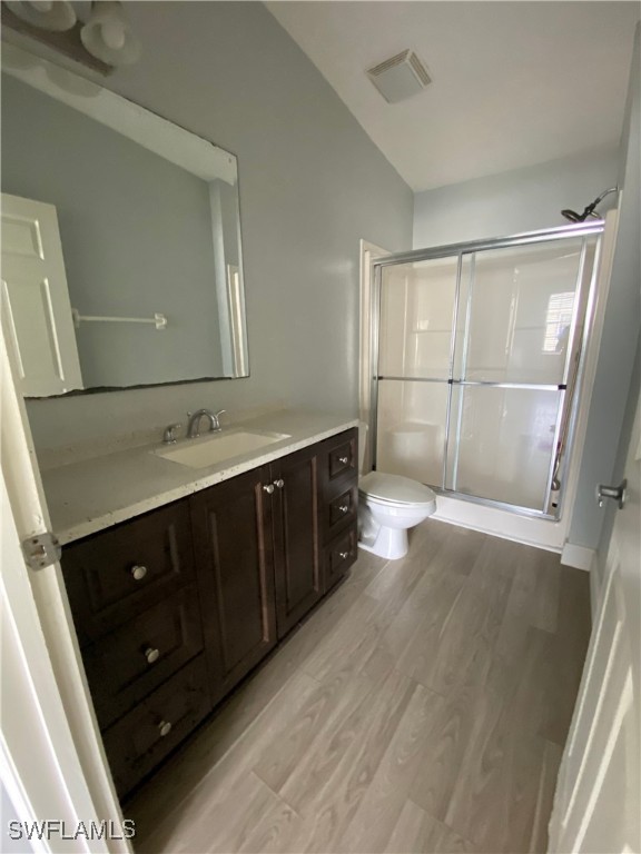 5527 Judith Road, Unit B Bokeelia, FL 33922 - Photo 4 of 8 a bathroom with a sink vanity and mirror