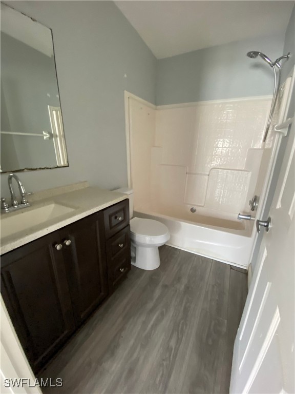5527 Judith Road, Unit B Bokeelia, FL 33922 - Photo 5 of 8 a bathroom with a sink a toilet a shower and a mirror