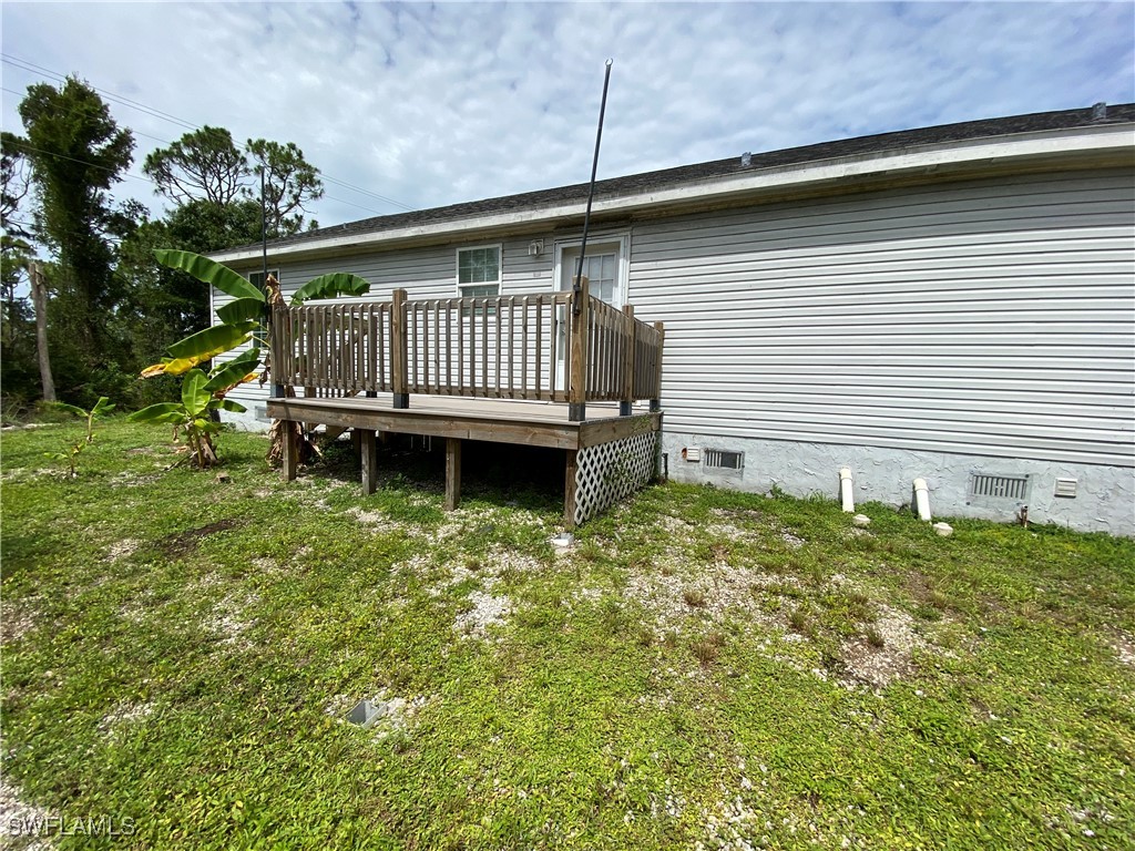 5527 Judith Road, Unit B Bokeelia, FL 33922 - Photo 8 of 8 a view of a backyard with a deck