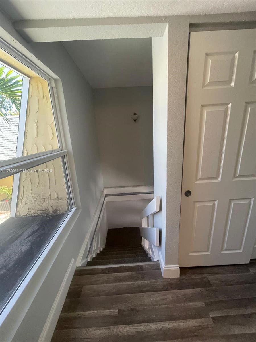 Boynton Beach Boynton Beach, FL 33435 - Photo 12 of 22 a view of staircase with wooden floor and window