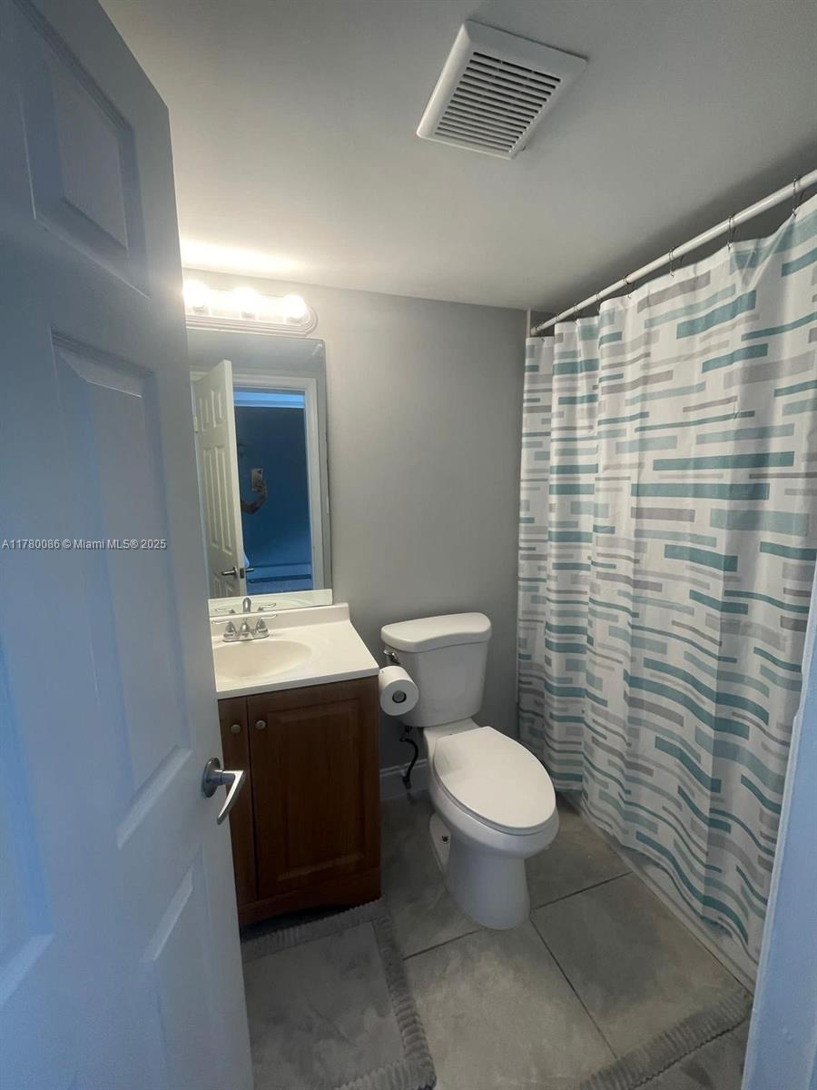 Boynton Beach Boynton Beach, FL 33435 - Photo 10 of 22 a bathroom with a sink toilet and shower