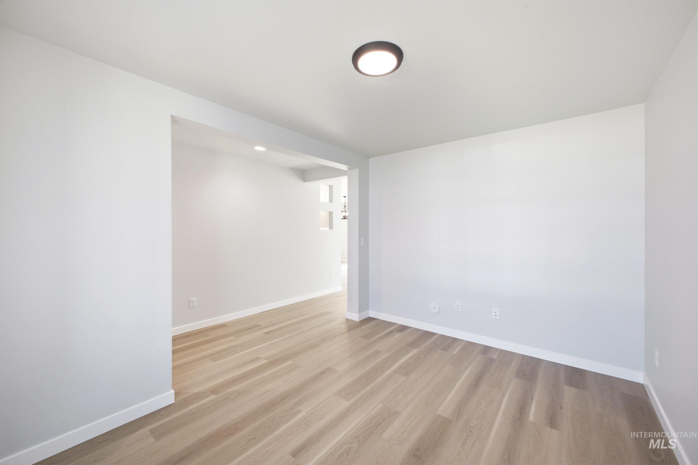 13336 Bank Street Caldwell, ID 83607 - Photo 3 of 24 Recessed lighting, wood-finish flooring, and a neutral color palette