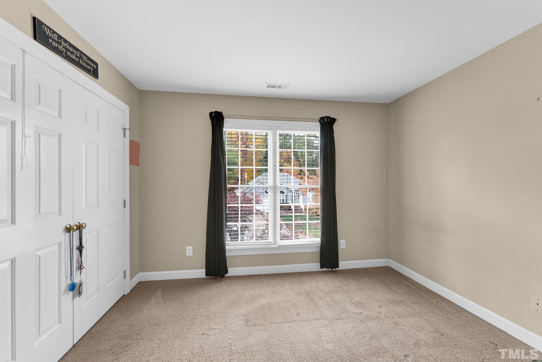 11619 Shavenrock Place Raleigh, NC 27613 - Photo 16 of 20 an empty room with windows