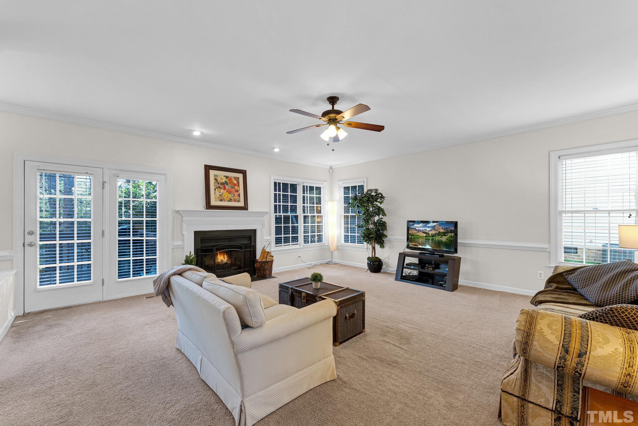 11619 Shavenrock Place Raleigh, NC 27613 - Photo 7 of 20 a living room with furniture and a fireplace