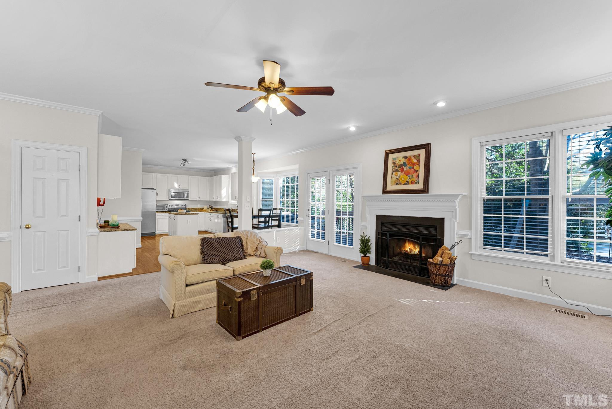 11619 Shavenrock Place Raleigh, NC 27613 - Photo 9 of 20 a living room with furniture and a fireplace