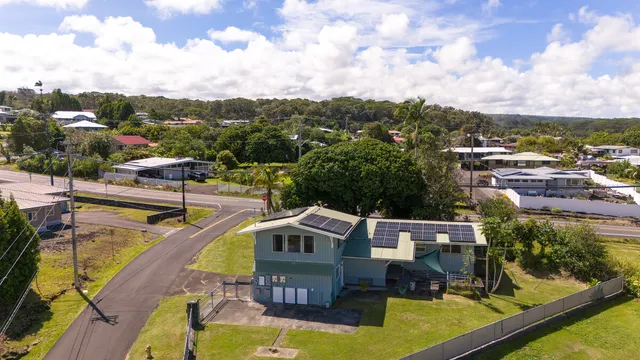 a view of a lake with a house in the background