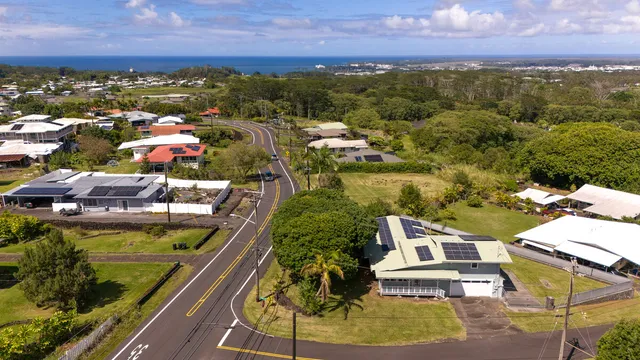 a view of a swimming pool with lawn chairs
