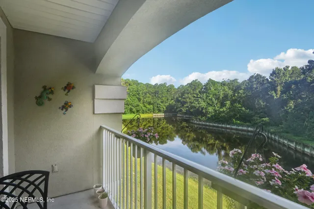 a view of a lake from a balcony