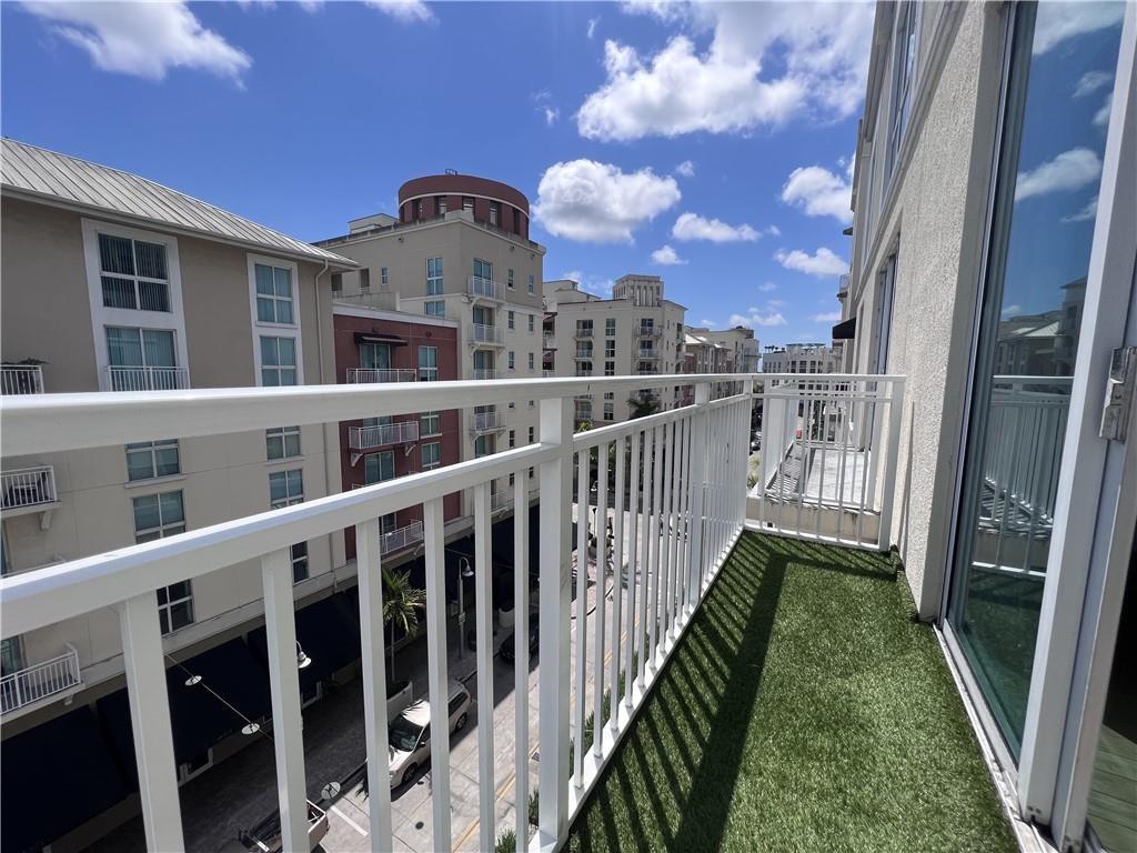 7275 Southwest 89th Street, Unit B520 Miami, FL 33156 - Photo 13 of 26 a view of a large building with a yard