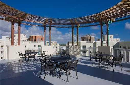 7275 Southwest 89th Street, Unit B520 Miami, FL 33156 - Photo 26 of 26 a view of a dining room with furniture and chandelier