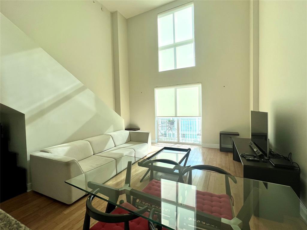 7275 Southwest 89th Street, Unit B520 Miami, FL 33156 - Photo 7 of 26 a living room with furniture and a window