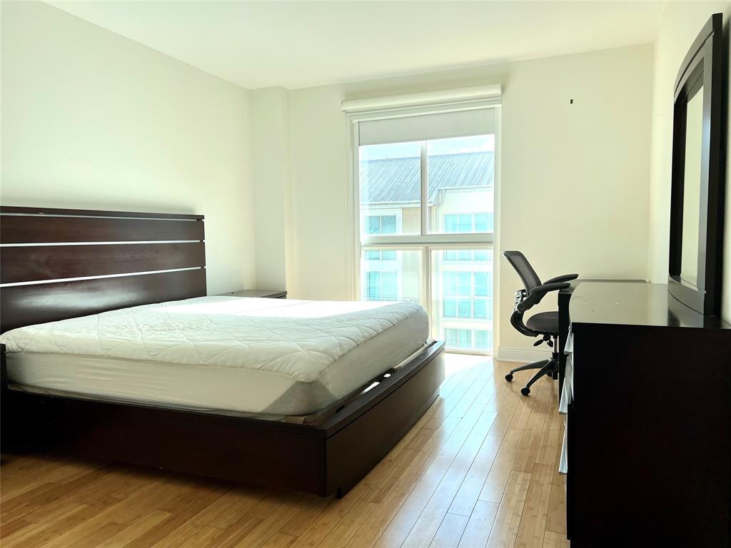 7275 Southwest 89th Street, Unit B520 Miami, FL 33156 - Photo 8 of 26 a bed sitting in a bedroom next to a window