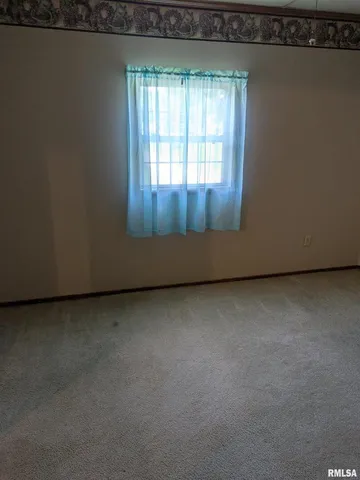 a view of a room that has a window in it