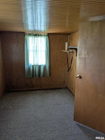 a view of a room that has a large window